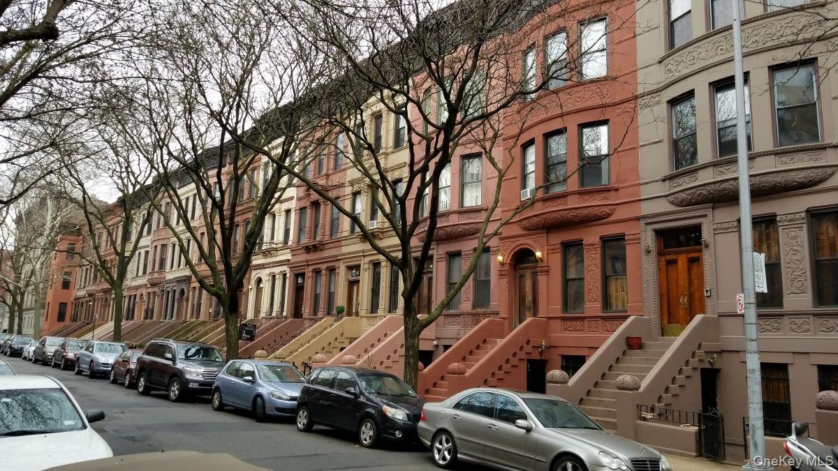 235 West 137th Street, Unit 1F Manhattan, NY 10030 - Photo 23 of 27 a car parked in front of a building