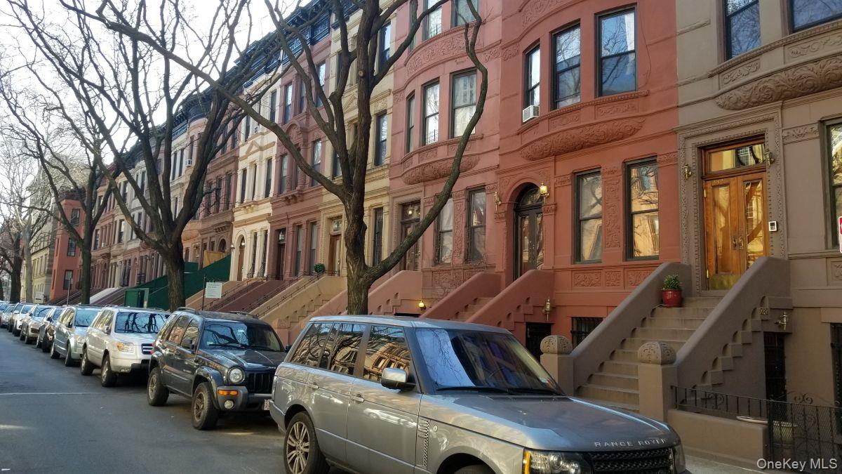 235 West 137th Street, Unit 1F Manhattan, NY 10030 - Photo 24 of 27 a view of a brick building with many windows