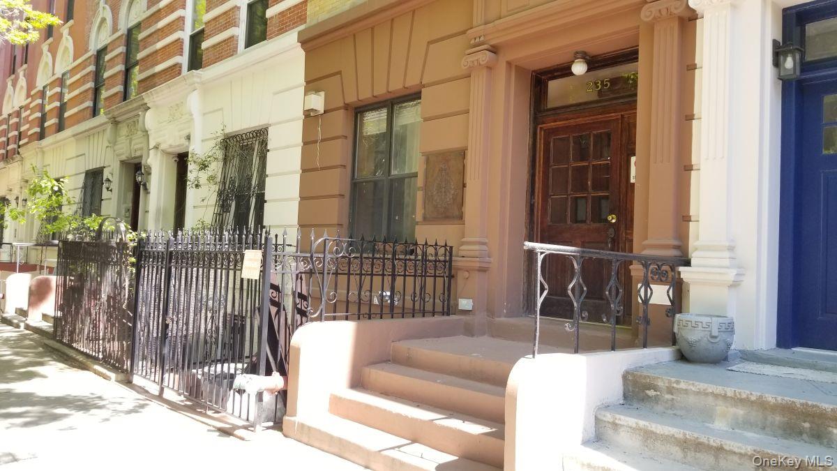 235 West 137th Street, Unit 1F Manhattan, NY 10030 - Photo 25 of 27 a view of a building with a couch