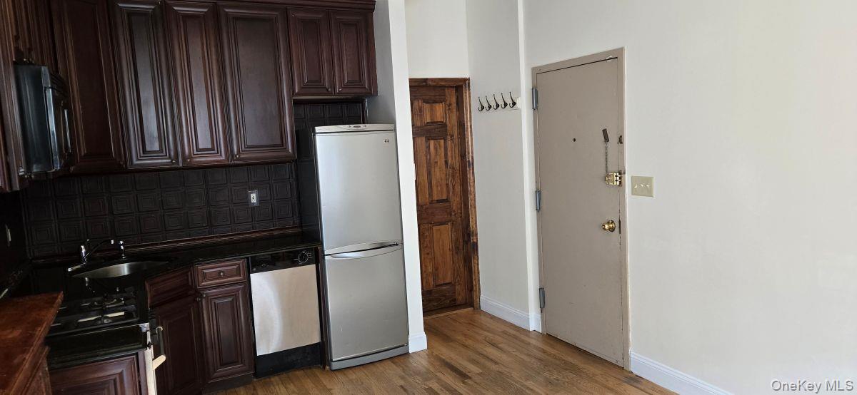 235 West 137th Street, Unit 1F Manhattan, NY 10030 - Photo 7 of 27 a view of walk in closet with wooden floor