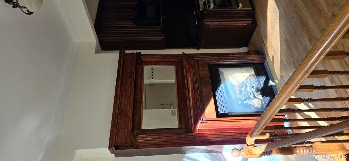 235 West 137th Street, Unit 1F Manhattan, NY 10030 - Photo 9 of 27 a fireplace with wooden floor