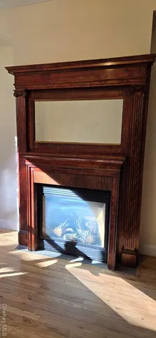 a view of fireplace and wooden floor