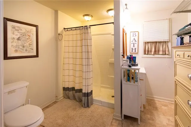 a view of a dining room with furniture and window