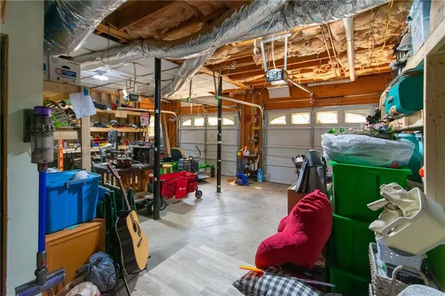 a living room with furniture fireplace and a window