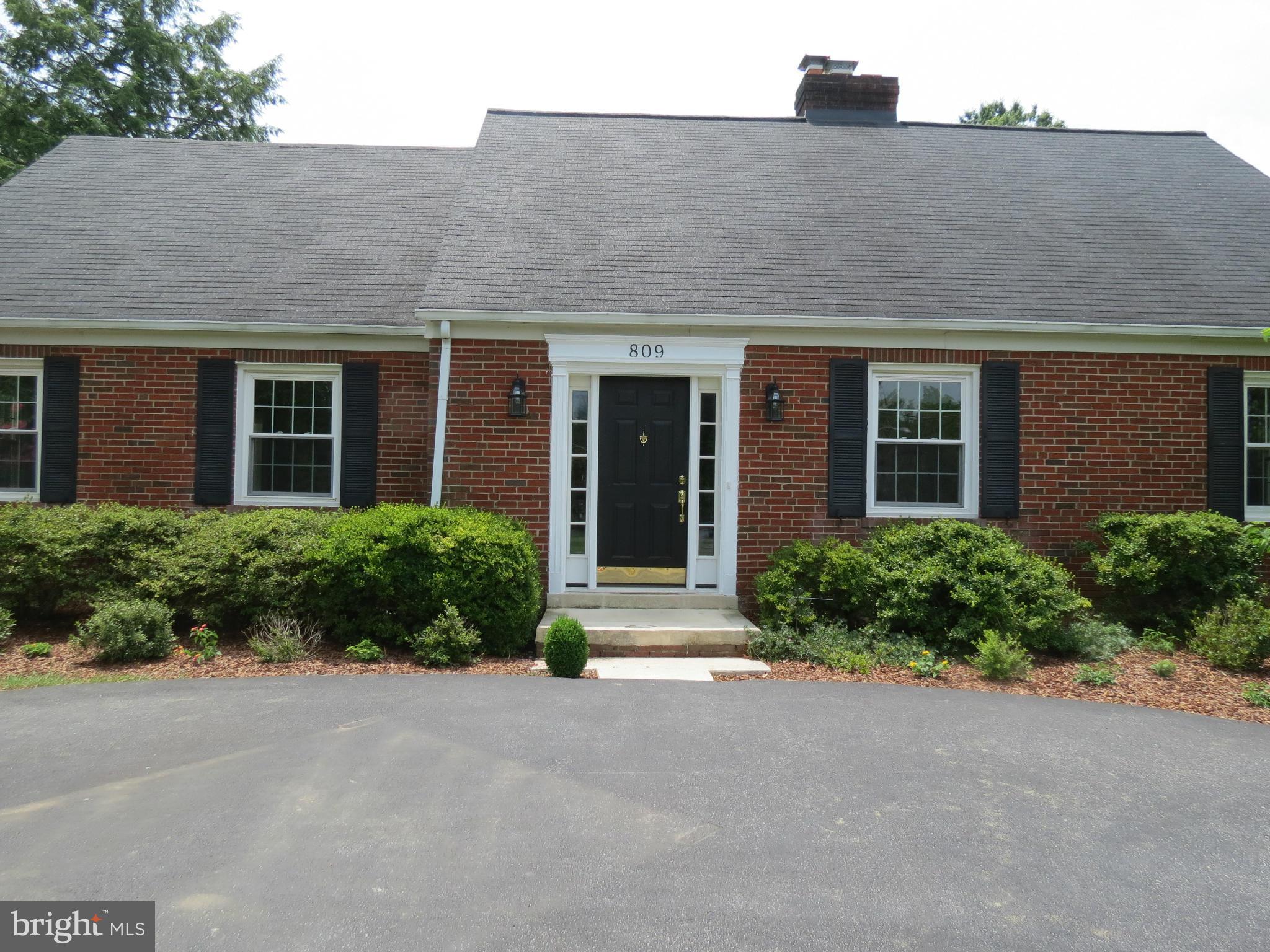 809 Orchard Way Silver Spring, MD 20904 - Photo 3 of 30 front view of a brick house with potted plants