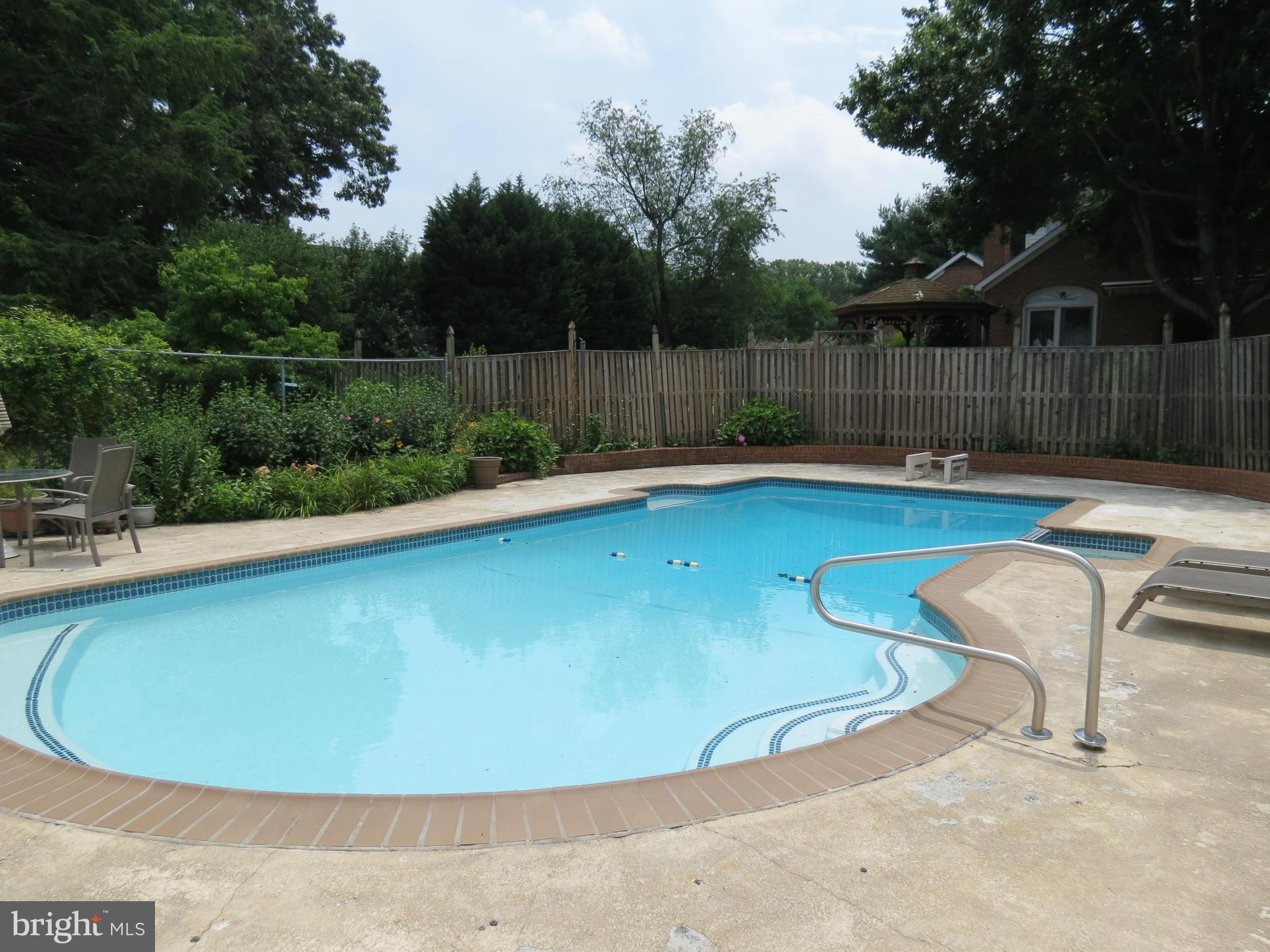 809 Orchard Way Silver Spring, MD 20904 - Photo 5 of 30 a view of a swimming pool with a yard and sitting space