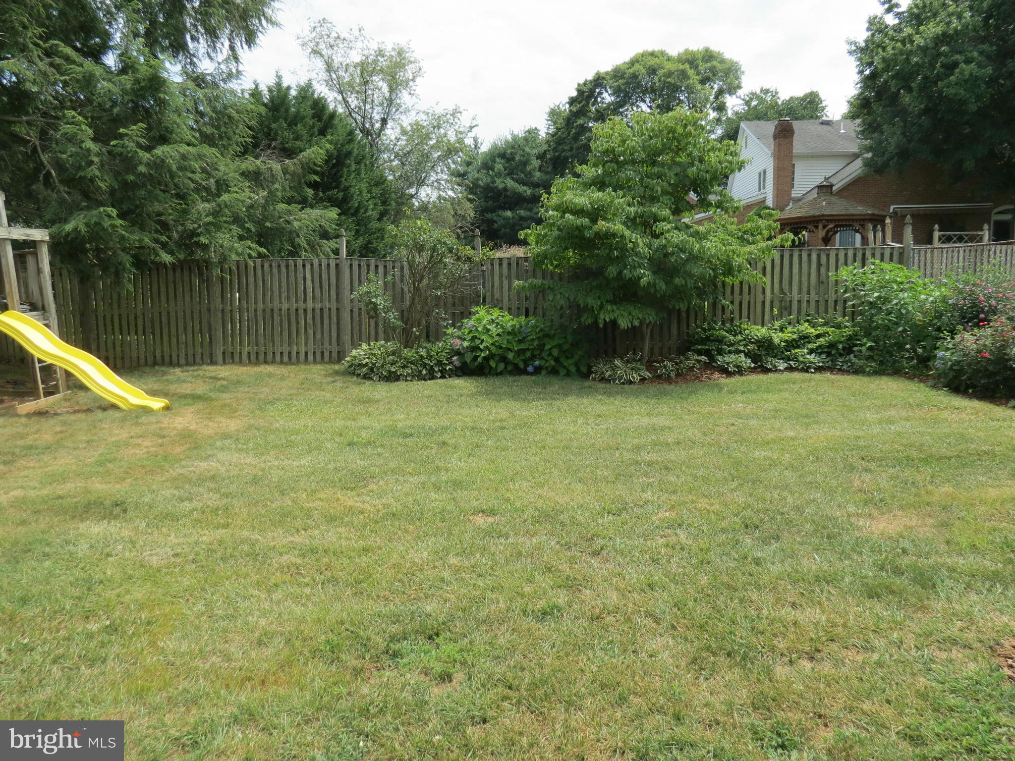 809 Orchard Way Silver Spring, MD 20904 - Photo 7 of 30 a view of a yard with a wooden fence