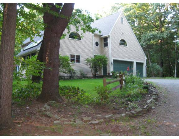 397 Langen Road Lancaster, MA 01523 - Photo 1 of 16 a view of house with a yard and potted plants