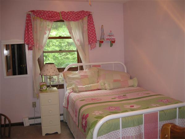 397 Langen Road Lancaster, MA 01523 - Photo 11 of 16 a bedroom with a bed and a window