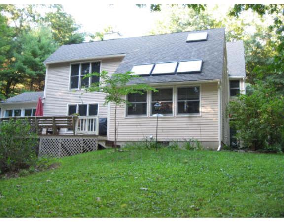 397 Langen Road Lancaster, MA 01523 - Photo 12 of 16 a front view of a house with garden