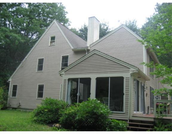 397 Langen Road Lancaster, MA 01523 - Photo 14 of 16 a view of a white house next to a yard