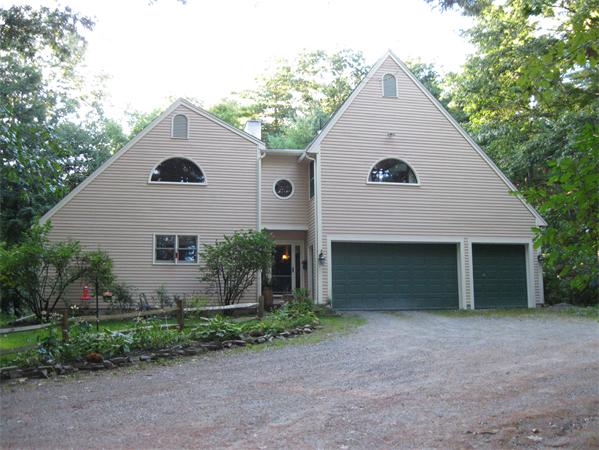 397 Langen Road Lancaster, MA 01523 - Photo 15 of 16 a view of a house with a yard and plants