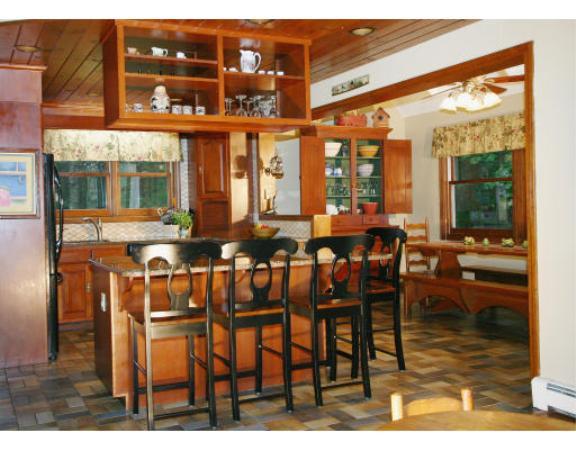 397 Langen Road Lancaster, MA 01523 - Photo 5 of 16 a dining room with furniture a chandelier and wooden floor