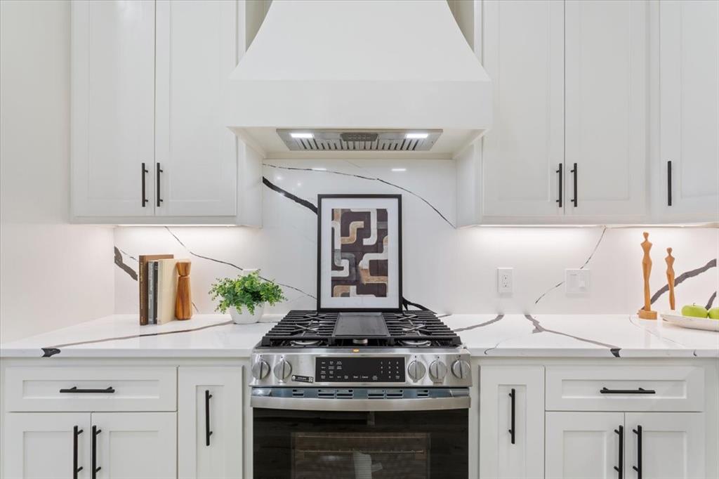 107 North Jena Street Riesel, TX 76682 - Photo 13 of 34 a stove top oven sitting inside of a kitchen