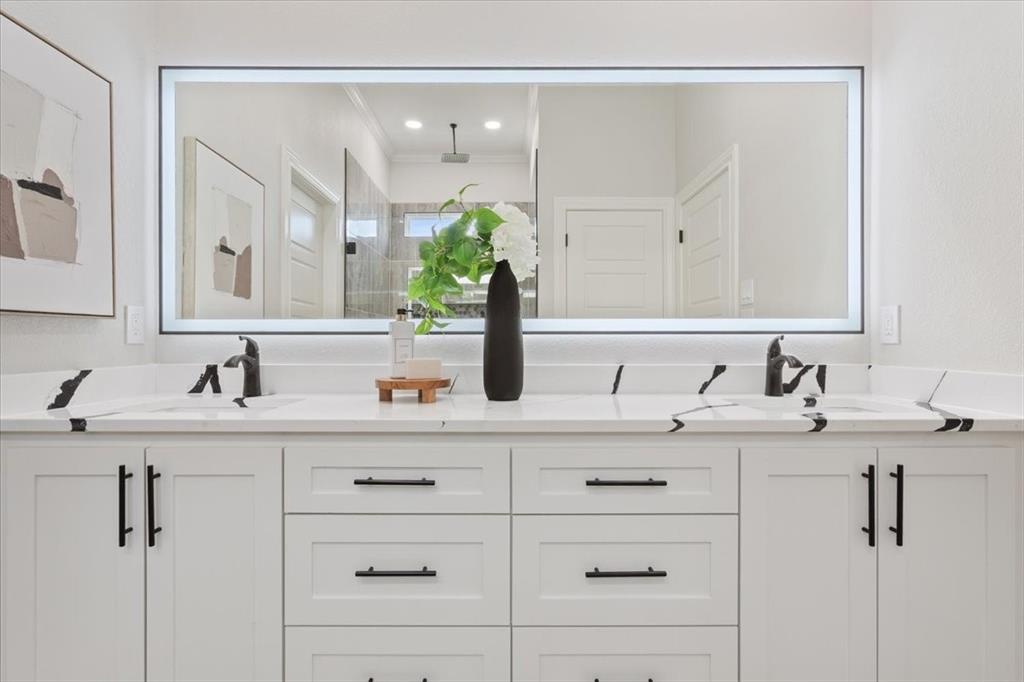 107 North Jena Street Riesel, TX 76682 - Photo 18 of 34 a bathroom with a sink and a mirror