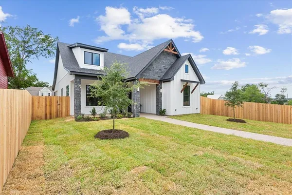 a house view with a backyard space
