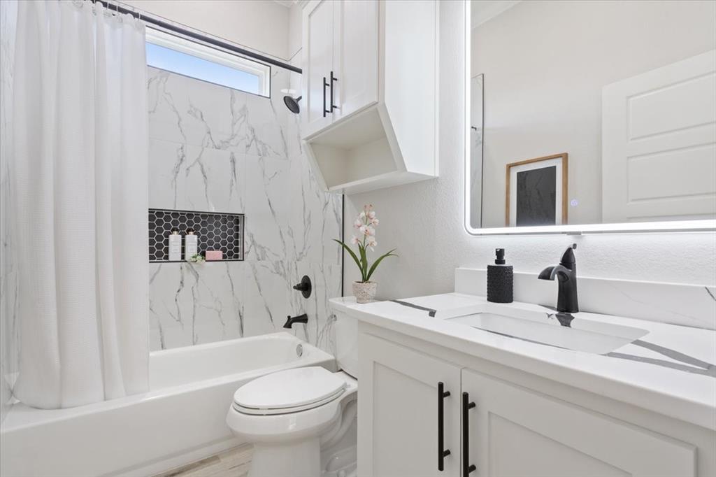 107 North Jena Street Riesel, TX 76682 - Photo 24 of 34 a bathroom with a sink a toilet and shower