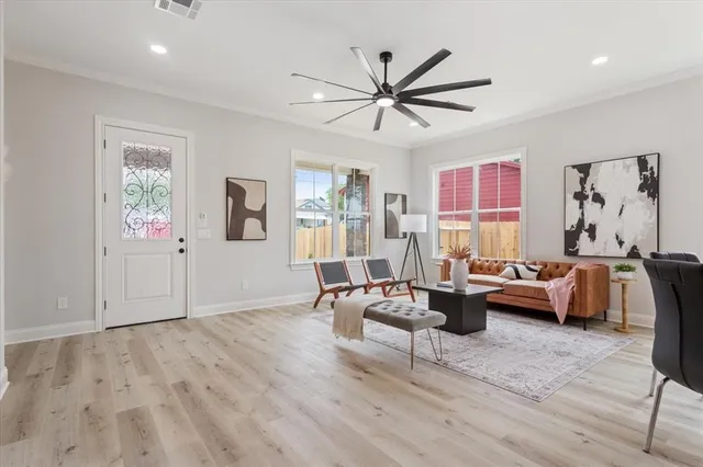 a living room with furniture and a large window