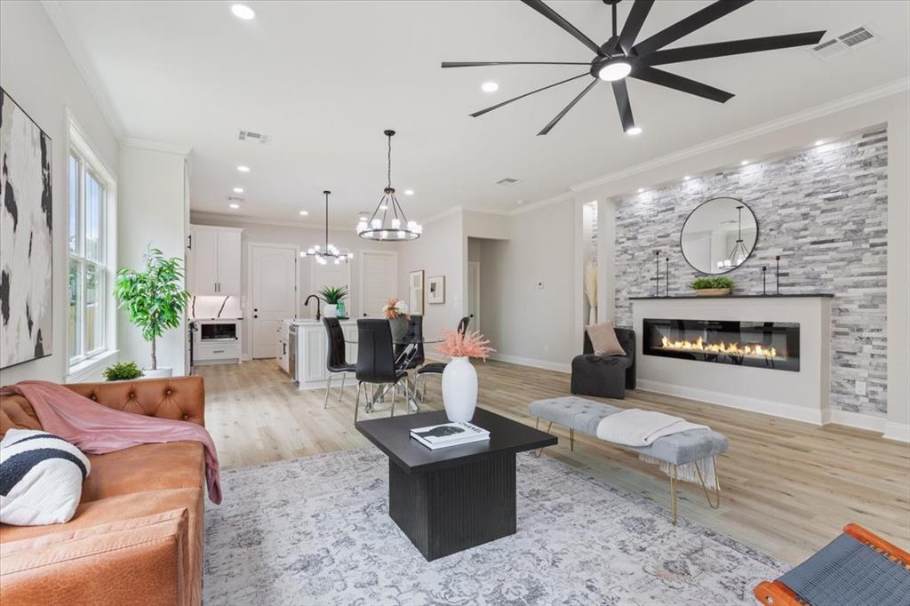 107 North Jena Street Riesel, TX 76682 - Photo 7 of 34 a living room with furniture and a fireplace