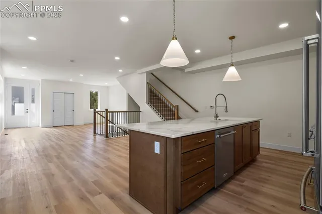 a kitchen with a stove and a sink