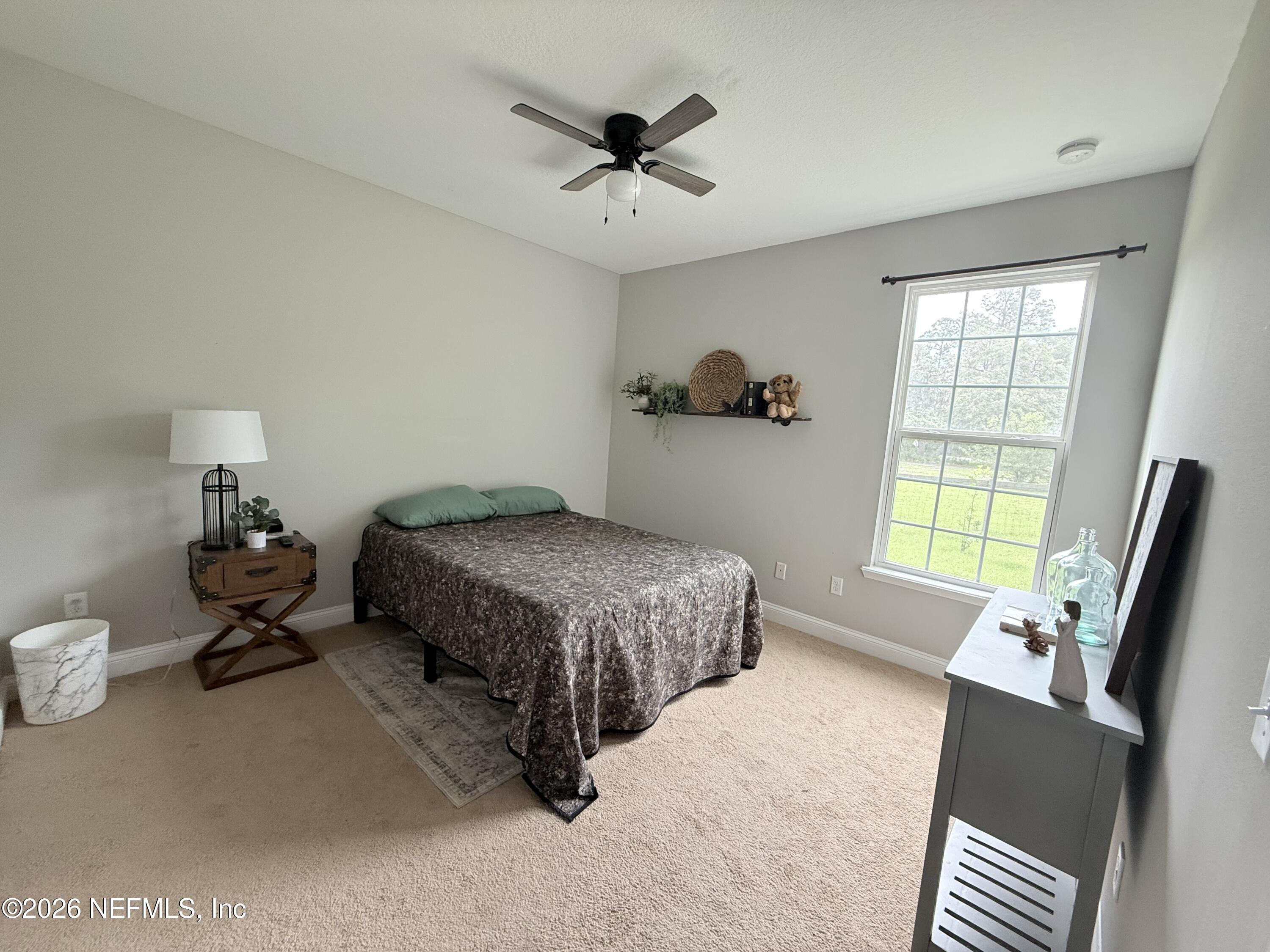 204 Comer Road Palatka, FL 32177 - Photo 10 of 15 a bedroom with a bed and window
