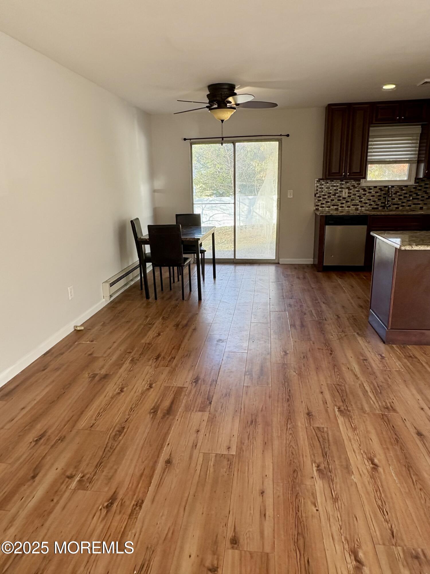 4 A Primrose Lane Jackson, NJ 08527 - Photo 6 of 14 a dining room with furniture and wooden floor