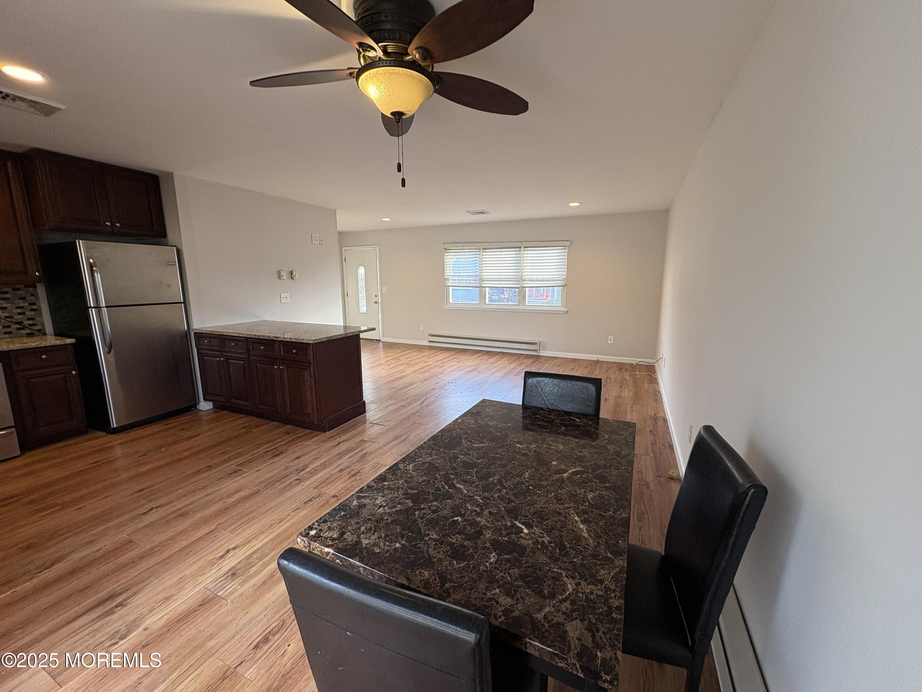 4 A Primrose Lane Jackson, NJ 08527 - Photo 7 of 14 a kitchen with stainless steel appliances granite countertop a sink dishwasher and a stove top oven