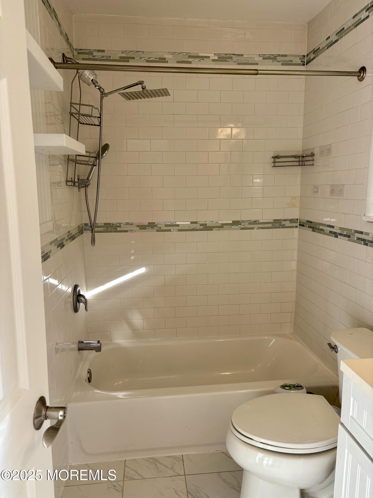 4 A Primrose Lane Jackson, NJ 08527 - Photo 10 of 14 a bathroom with a shower and a toilet