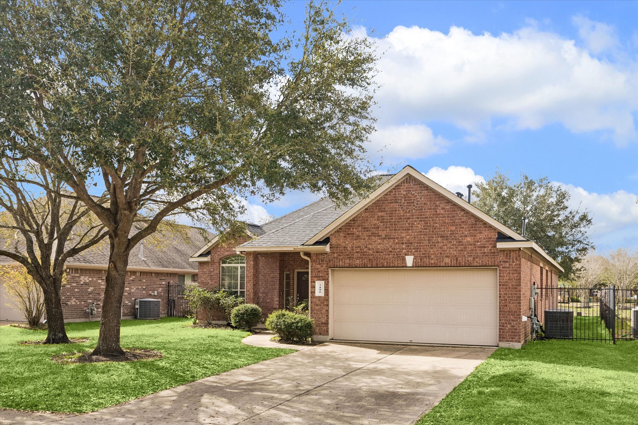 7806 Summer Night Lane Rosenberg, TX 77469 - Photo 23 of 23 Classic red brick construction with a gabled roofline and covered front porch creates a welcoming street presence.