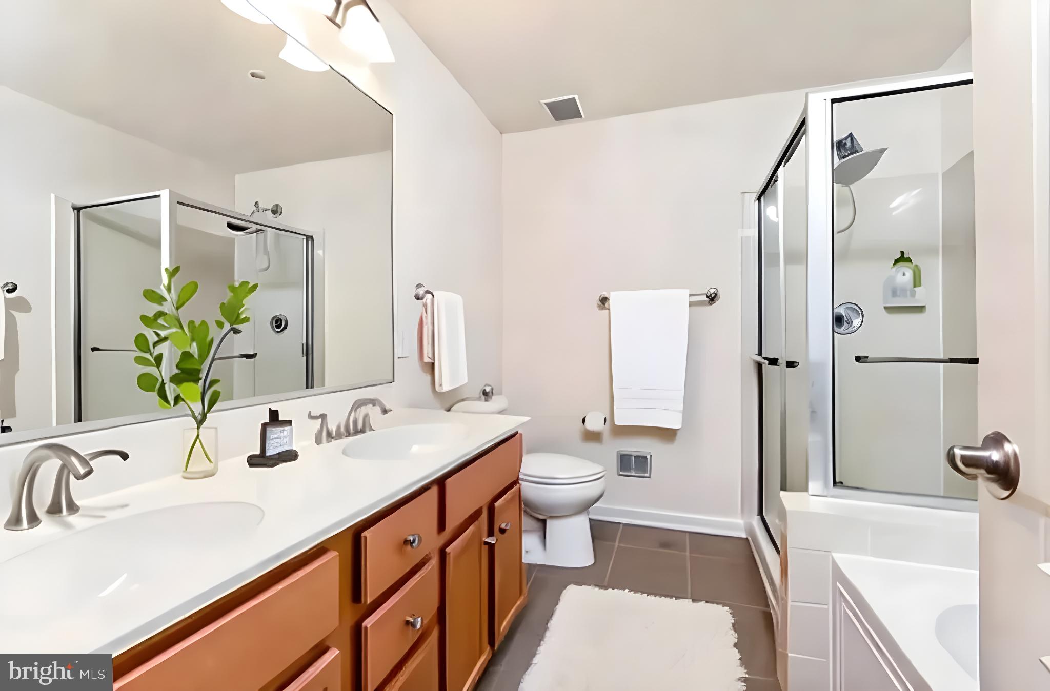 15250 Torbay Way Woodbridge, VA 22191 - Photo 13 of 31 a bathroom with a sink a toilet and shower