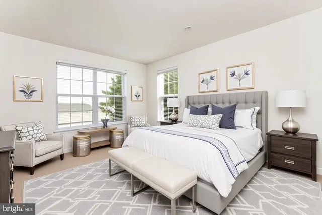 a view of a house with a yard and large tree