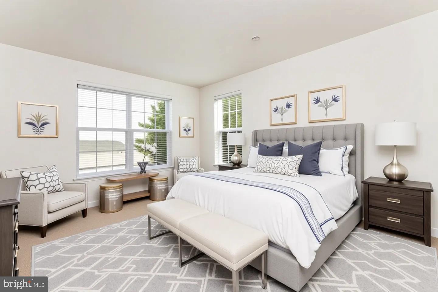 15250 Torbay Way Woodbridge, VA 22191 - Photo 15 of 31 a spacious bedroom with a bed and a couch