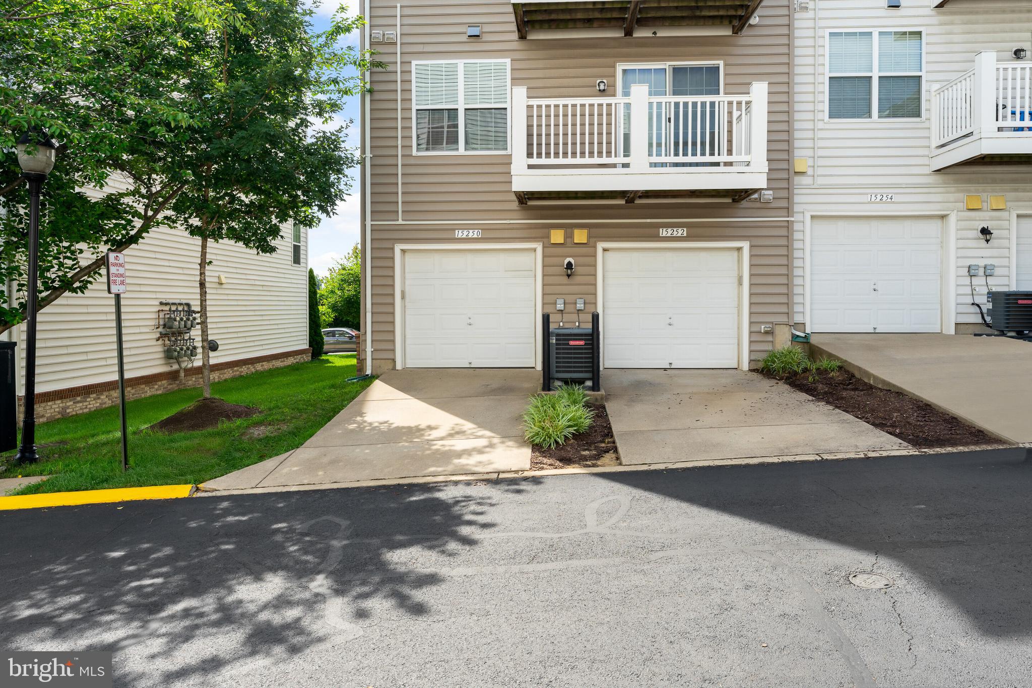 15250 Torbay Way Woodbridge, VA 22191 - Photo 16 of 31 a view of a house with a yard and large tree