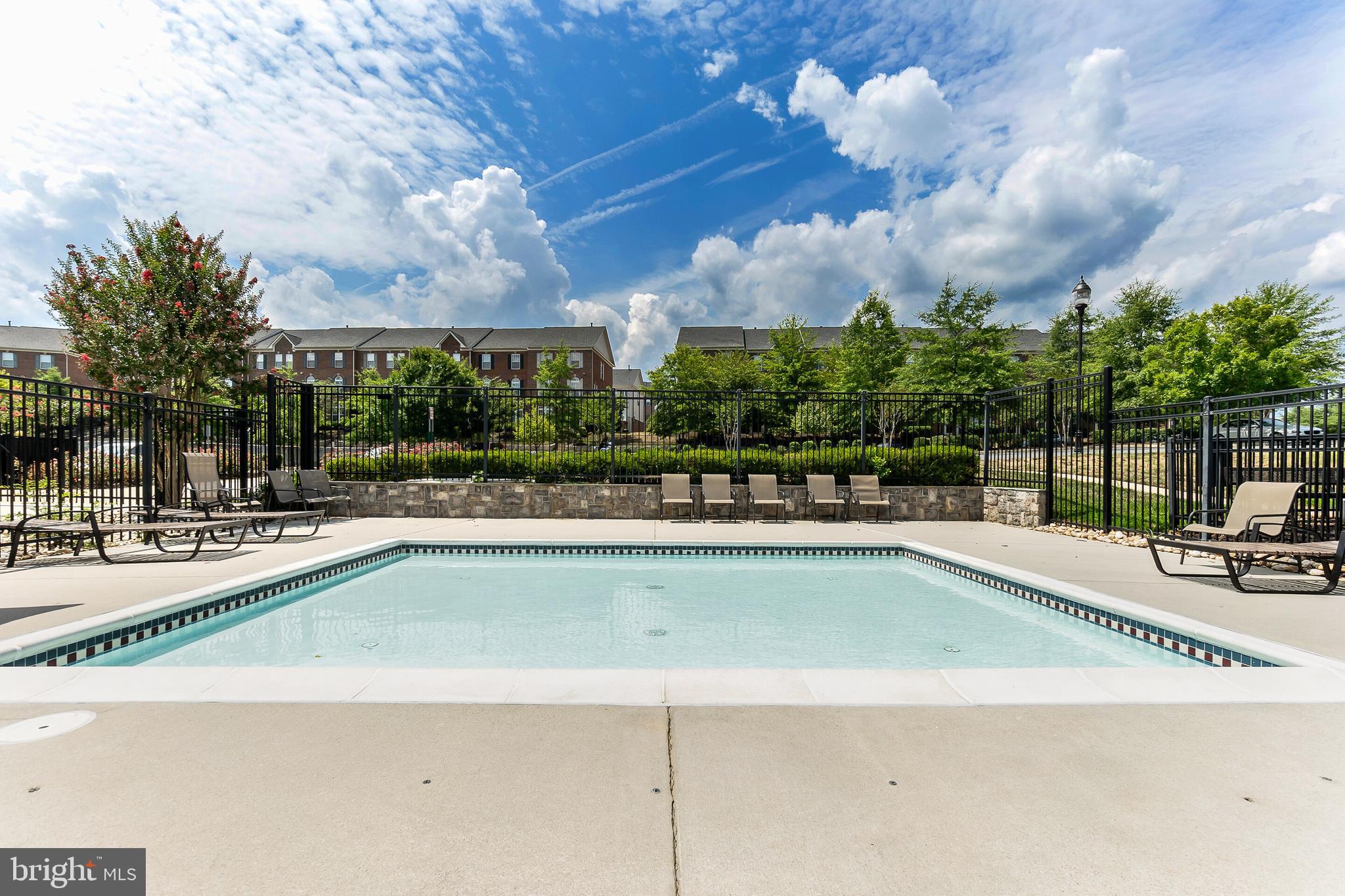 15250 Torbay Way Woodbridge, VA 22191 - Photo 24 of 31 a view of a swimming pool and lounge chairs