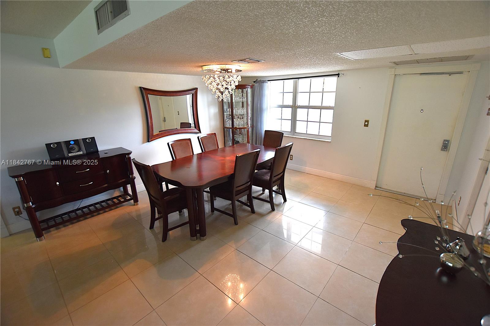 3800 Oaks Clubhouse Drive, Unit 309 Pompano Beach, FL 33069 - Photo 27 of 47 a view of a dining room with furniture