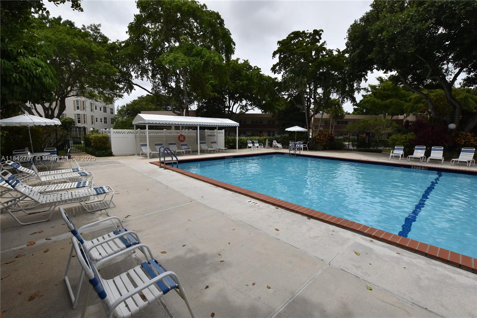 3800 Oaks Clubhouse Drive, Unit 309 Pompano Beach, FL 33069 - Photo 35 of 47 swimming pool view with a seating space