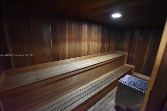 a wooden bench sitting in a room
