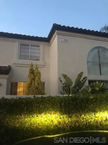 a view of house with backyard and garden
