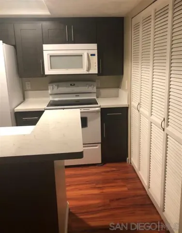 a kitchen with a stove and a microwave