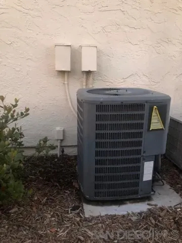a view of barbeque area with brick wall