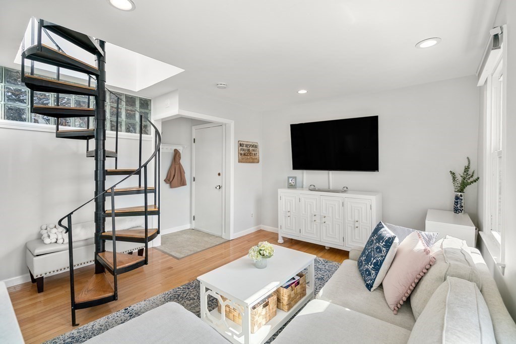 48-50 Russell Street, Unit 3A Boston, MA 02129 - Photo 4 of 11 a living room with furniture and a flat screen tv