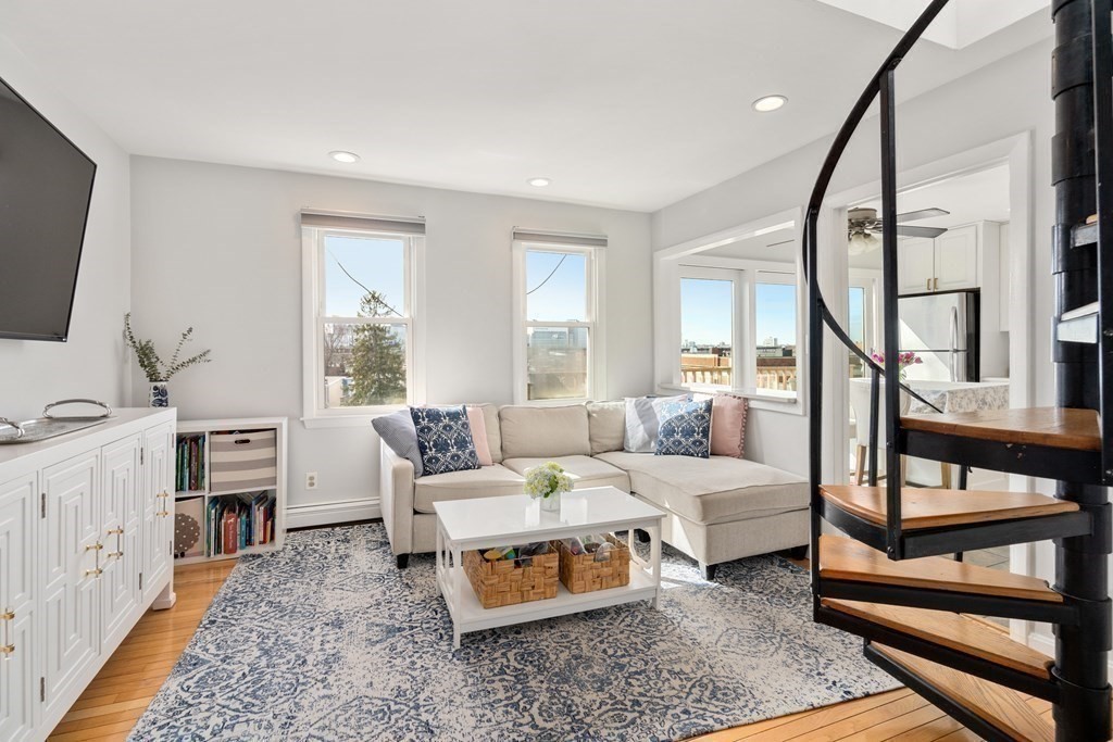 48-50 Russell Street, Unit 3A Boston, MA 02129 - Photo 6 of 11 a bedroom with furniture and a flat screen tv