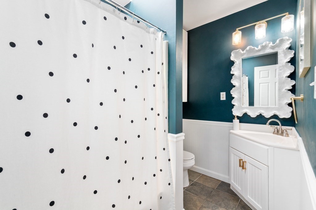 48-50 Russell Street, Unit 3A Boston, MA 02129 - Photo 9 of 11 a bathroom with a sink a toilet and a mirror