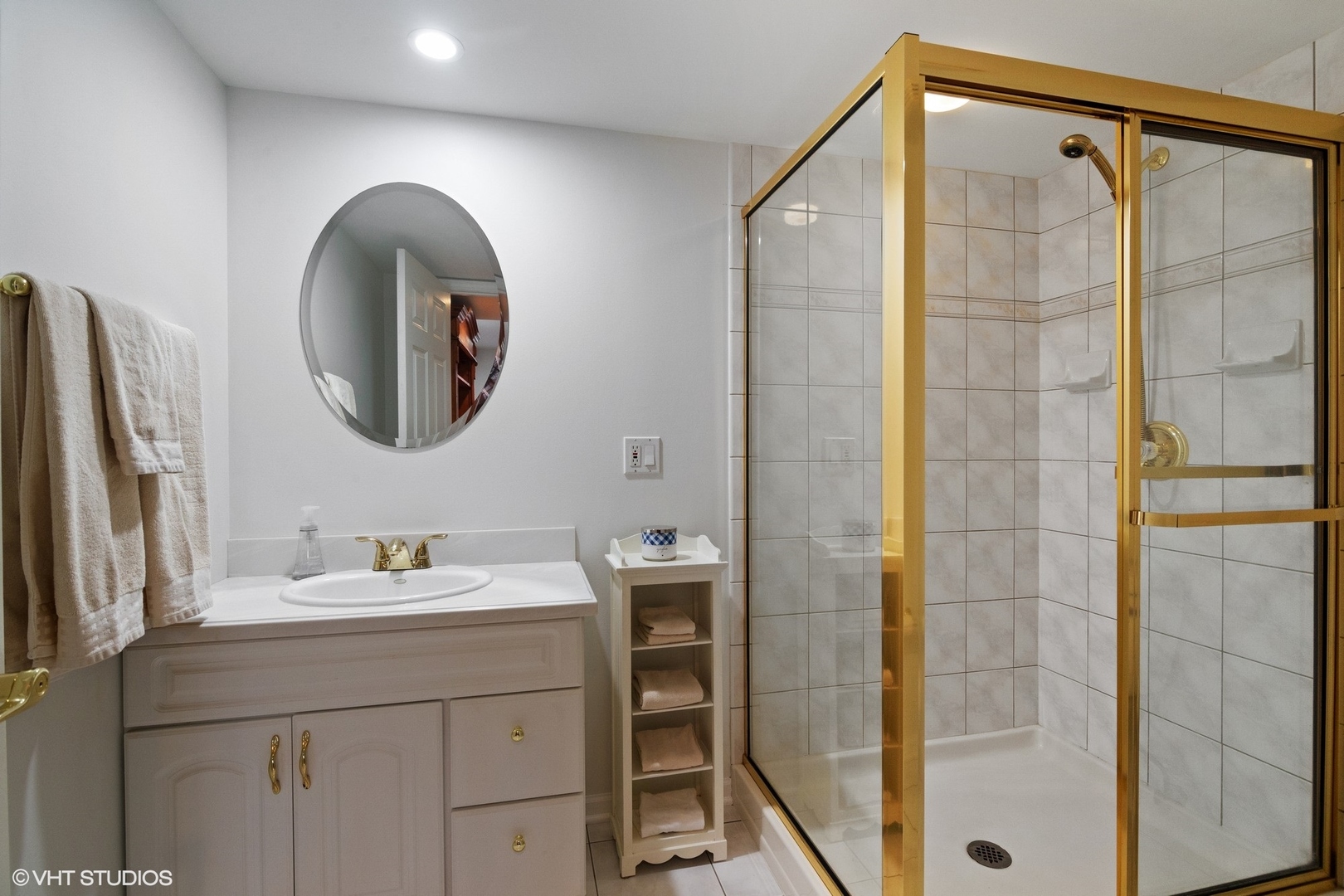 2413 Sand Lake Road Lindenhurst, IL 60046 - Photo 11 of 14 a bathroom with a sink and a mirror