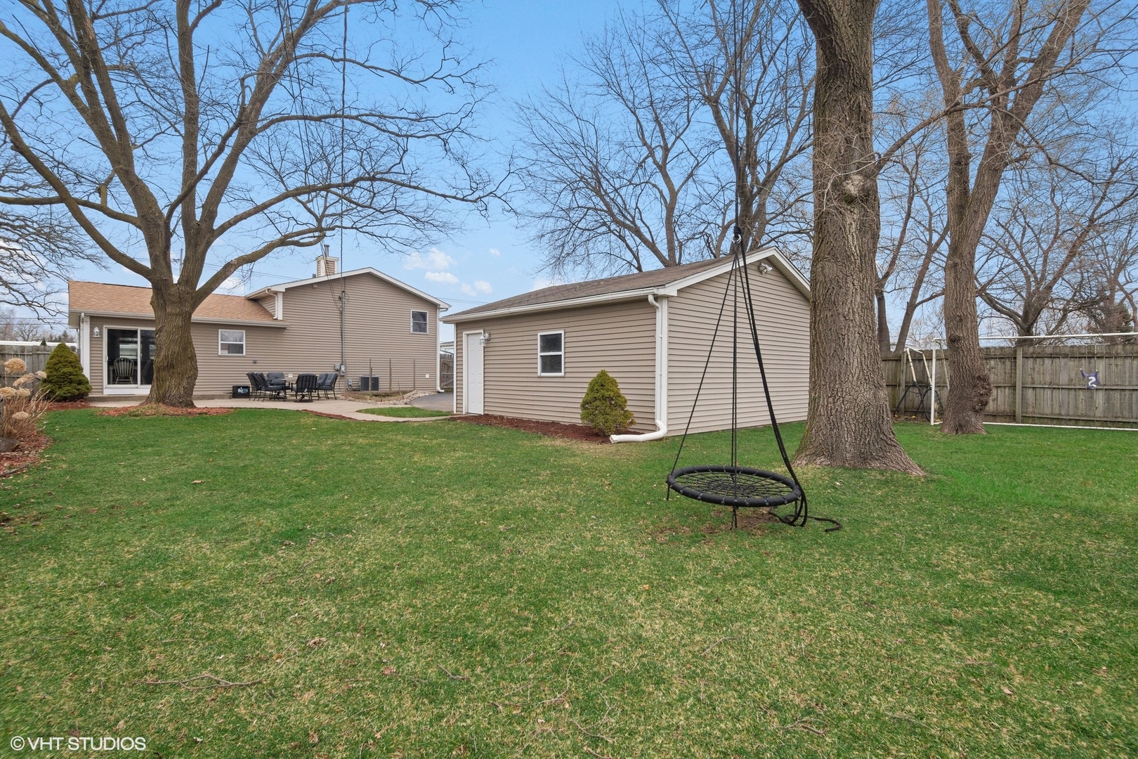 2413 Sand Lake Road Lindenhurst, IL 60046 - Photo 13 of 14 a view of a white house with a yard and large tree
