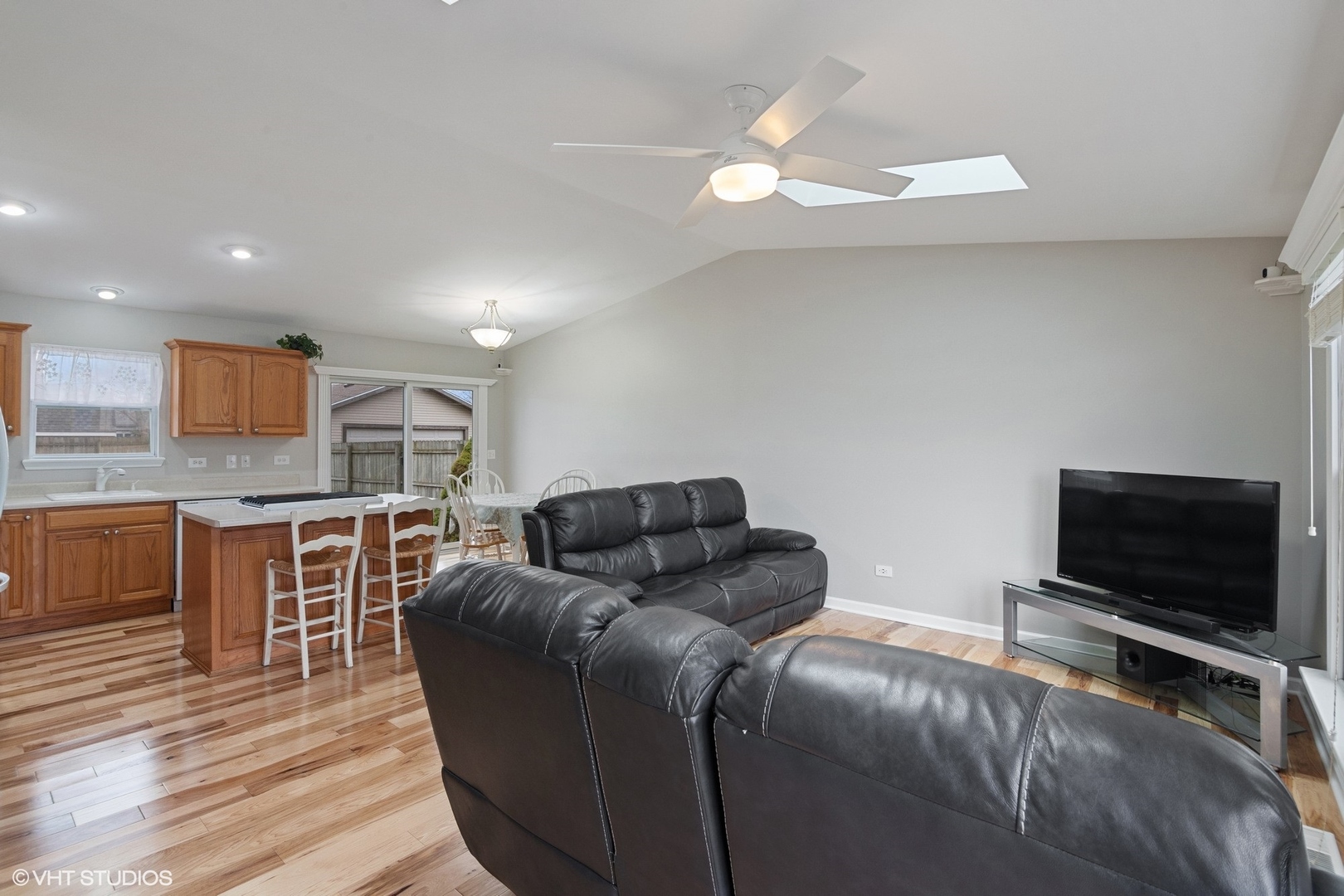 2413 Sand Lake Road Lindenhurst, IL 60046 - Photo 3 of 14 a living room with furniture and a flat screen tv