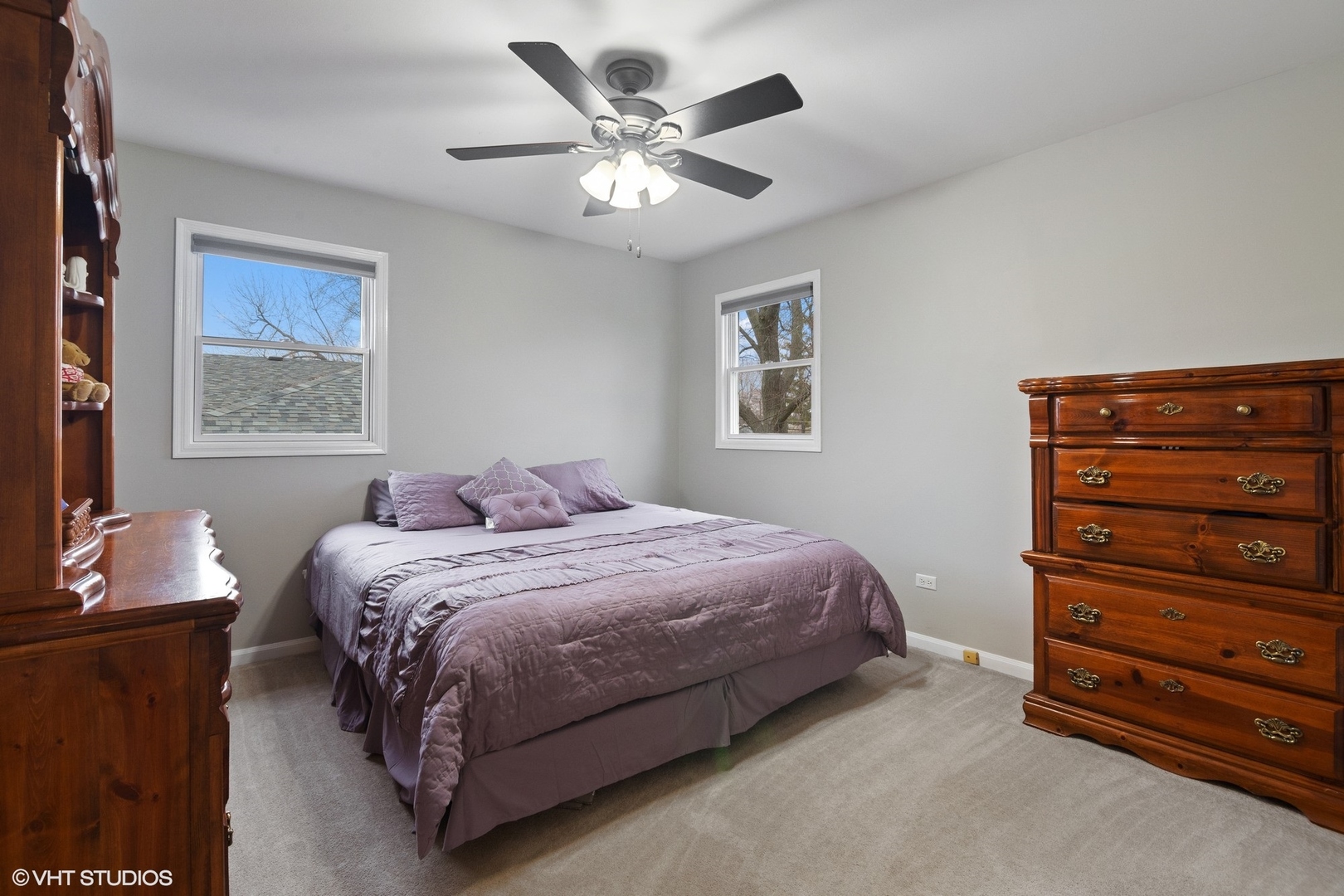 2413 Sand Lake Road Lindenhurst, IL 60046 - Photo 7 of 14 a bedroom with a bed and a chandelier
