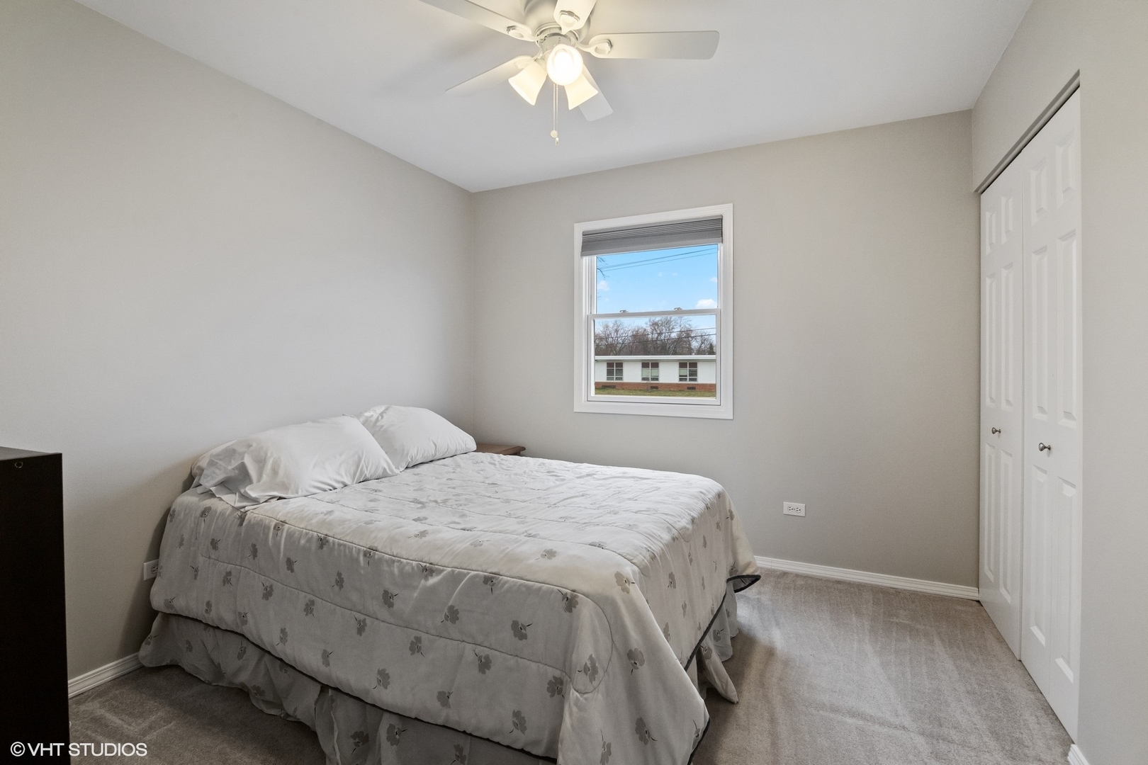 2413 Sand Lake Road Lindenhurst, IL 60046 - Photo 9 of 14 a bedroom with a bed and a chandelier