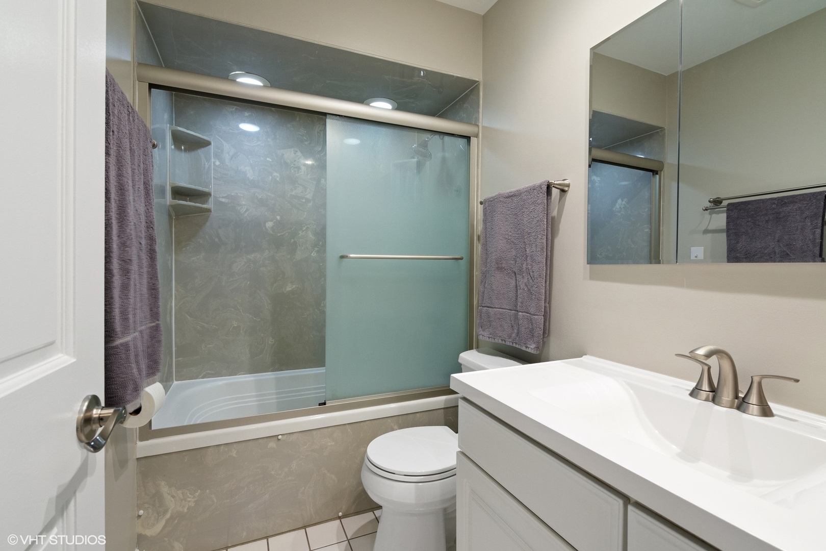 2413 Sand Lake Road Lindenhurst, IL 60046 - Photo 10 of 14 a bathroom with a sink a toilet and shower