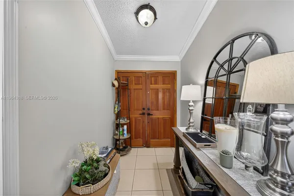 a kitchen with a sink appliances and cabinets